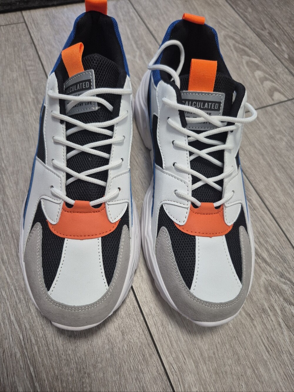 Calculated Color Block Orange/White/Blue/Black Men's Low Top Sneakers. Size 44EU